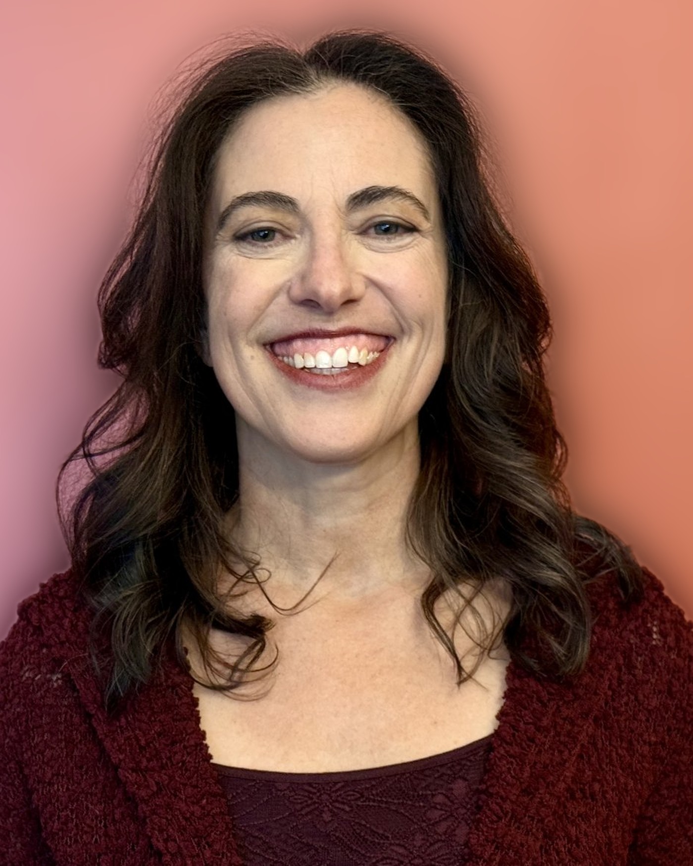 Asha Goldstein, smiling warmly